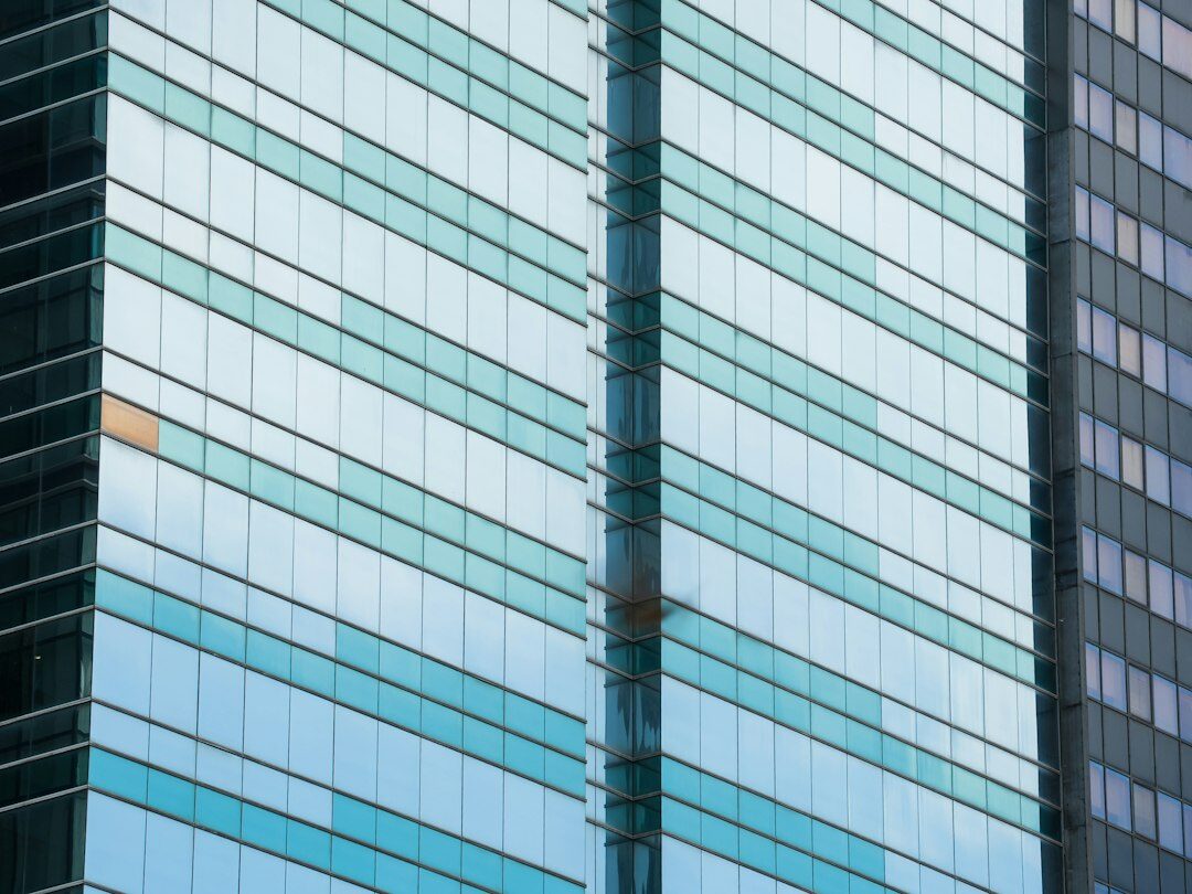 Modern corporate headquarters building facade with glass panels